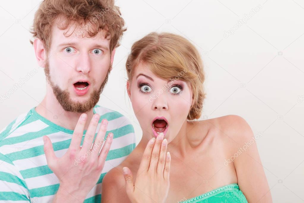  wide eyed couple surprised expression open mouth