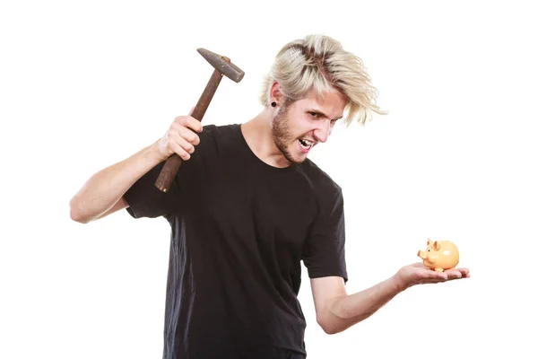 Sreaming man trying break piggy bank with hammer — Stock Photo, Image