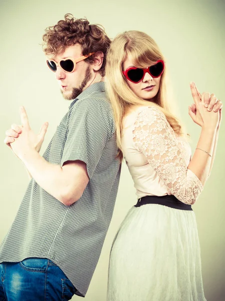 Couple man and woman making gun gesture. — Stock Photo, Image