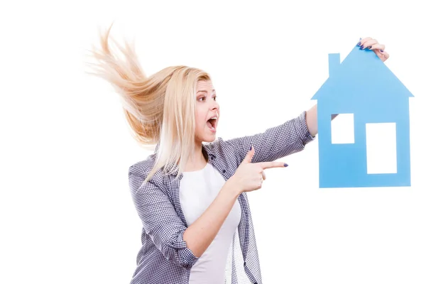 Happy woman holding blue paper house — Stock Photo, Image