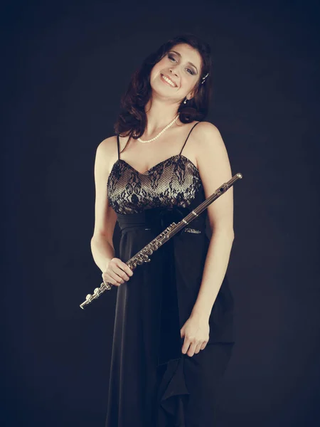 Elegant woman with flute instrument. — Stock Photo, Image