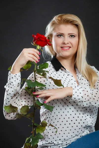 Woman holding rose flower on black — Stock Photo, Image