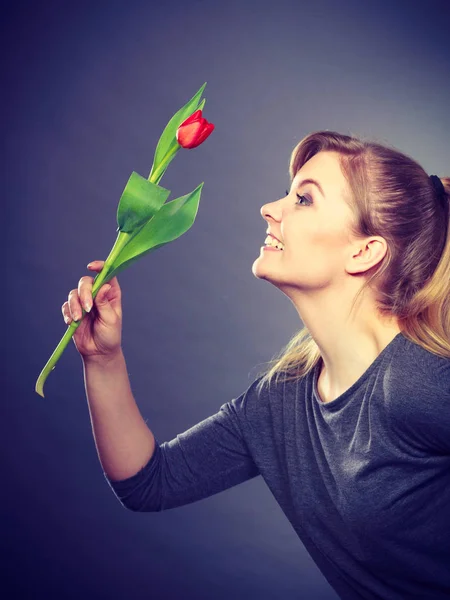 Cheering lady holding flower.