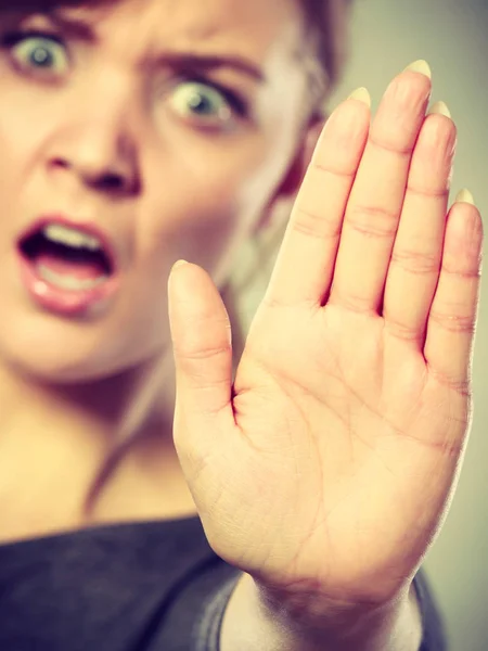 Female shows stop sign by her hand. — Stock Photo, Image