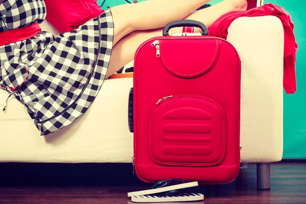 Woman relaxing after packing suitcase for vacation — Stock Photo, Image