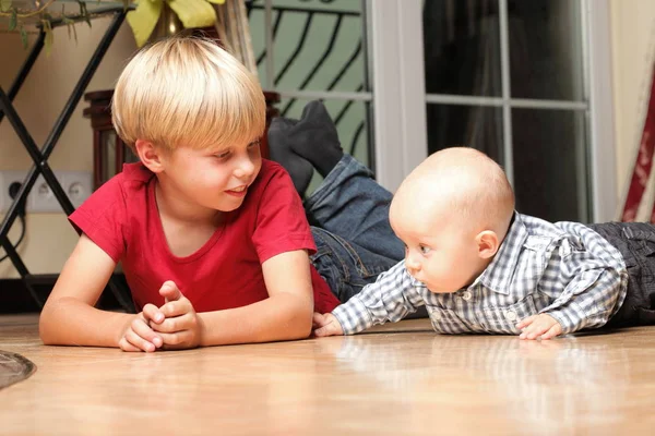 Little boy playing with a brother — Stock Photo, Image