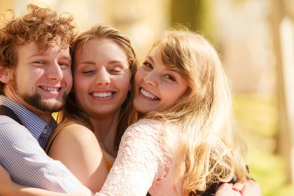 Three happy young people friends outdoor. — Stock Photo, Image