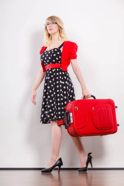 Elegant fashion woman with red suitcase — Stock Photo, Image