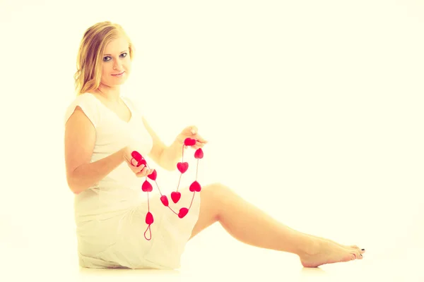 Woman with little red hearts. Charity. — Stock Photo, Image