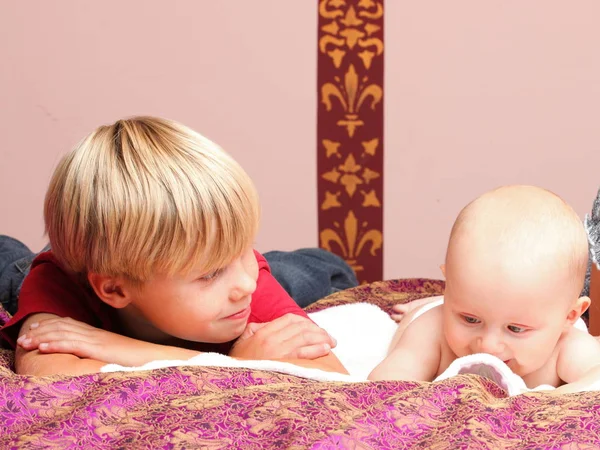 Little boy playing with a brother — Stock Photo, Image