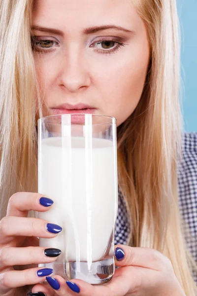 Woman drinking milk from glass