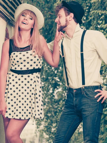 Loving couple retro style flirting outdoor