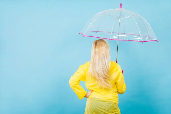 Blonde woman holding transparent umbrella — Stock Photo, Image