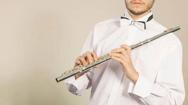 Flute music instrument in hands of flutist musician — Stock Photo, Image