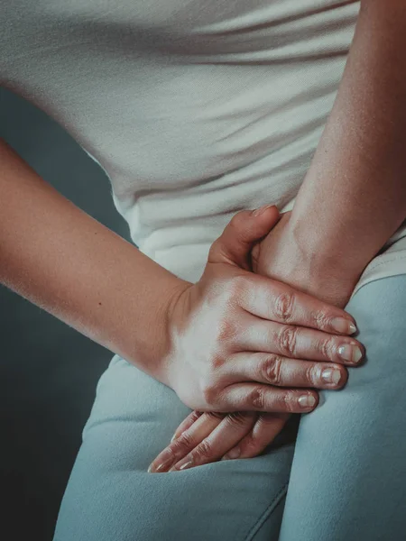 Woman with hands holding her crotch — Stock Image Woman with hands holding her crotch Royalty Free Stock Images