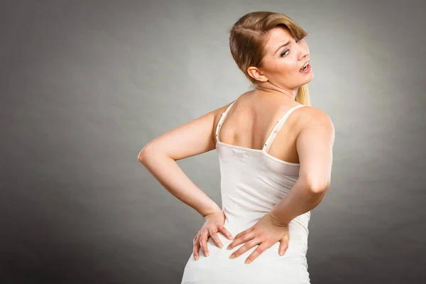 Woman suffering from back pain — Stock Photo, Image