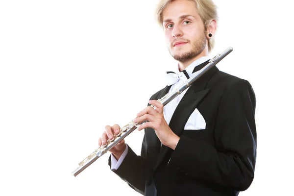 Male flutist wearing tailcoat holds flute — Stock Photo, Image