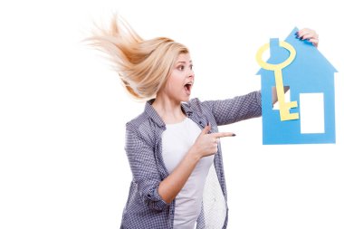 Happy woman holding blue paper house clipart