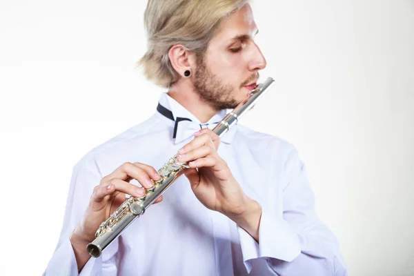 Male flutist playing his flute — Stock Photo, Image