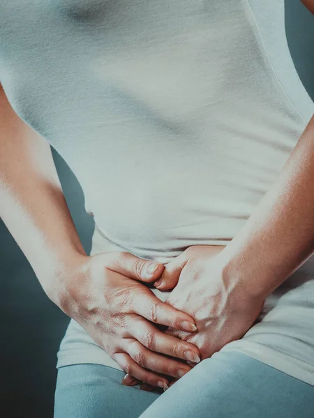 Woman with hands holding her crotch — Stock Image Woman with hands holding her crotch Stock Image