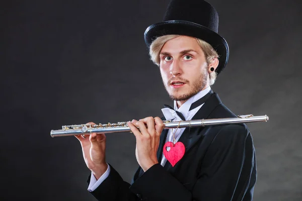 Male flutist with flute and heart. Love melody — Stock Photo, Image