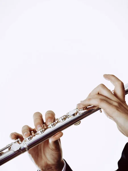 Male flutist plays flute — Stock Photo, Image