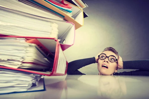 Accountant terrified of pils of binders. — Stock Photo, Image