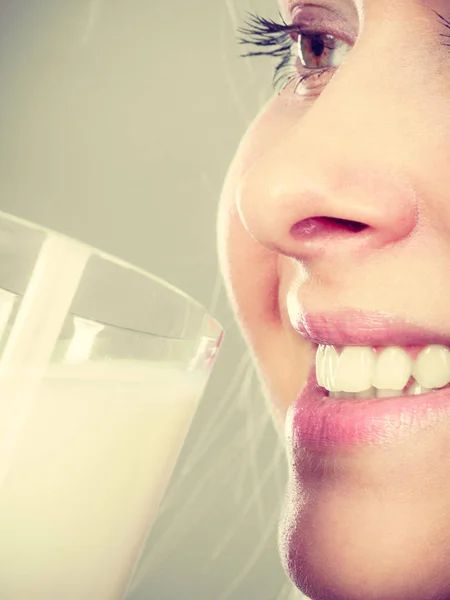 Woman drinking milk from glass — Stock Photo, Image