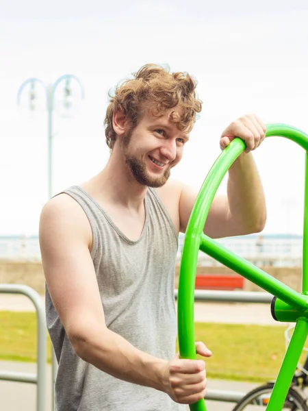 Active man exercising with tai chi wheel. — Stock Photo, Image