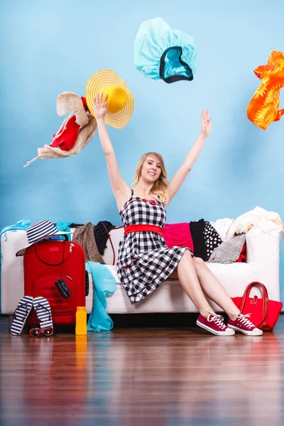 Woman throwing up clothes, clothing flying everywhere — Stock Photo, Image