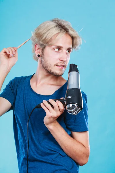 Trendy man with hair dryer — Stock Photo, Image