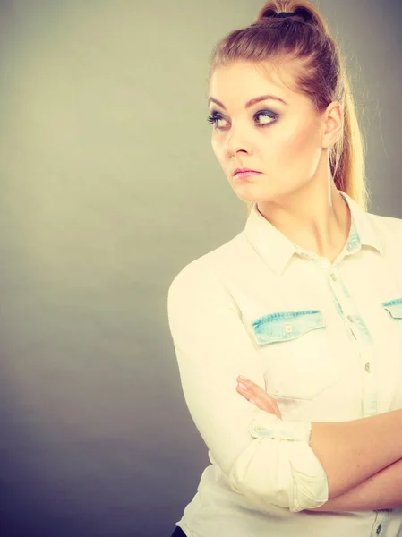 Angry woman looking very displeased standing with arms folded — Stock Photo, Image