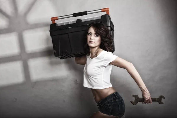 Sexy girl holding toolbox and wrench spanner — Stock Photo, Image