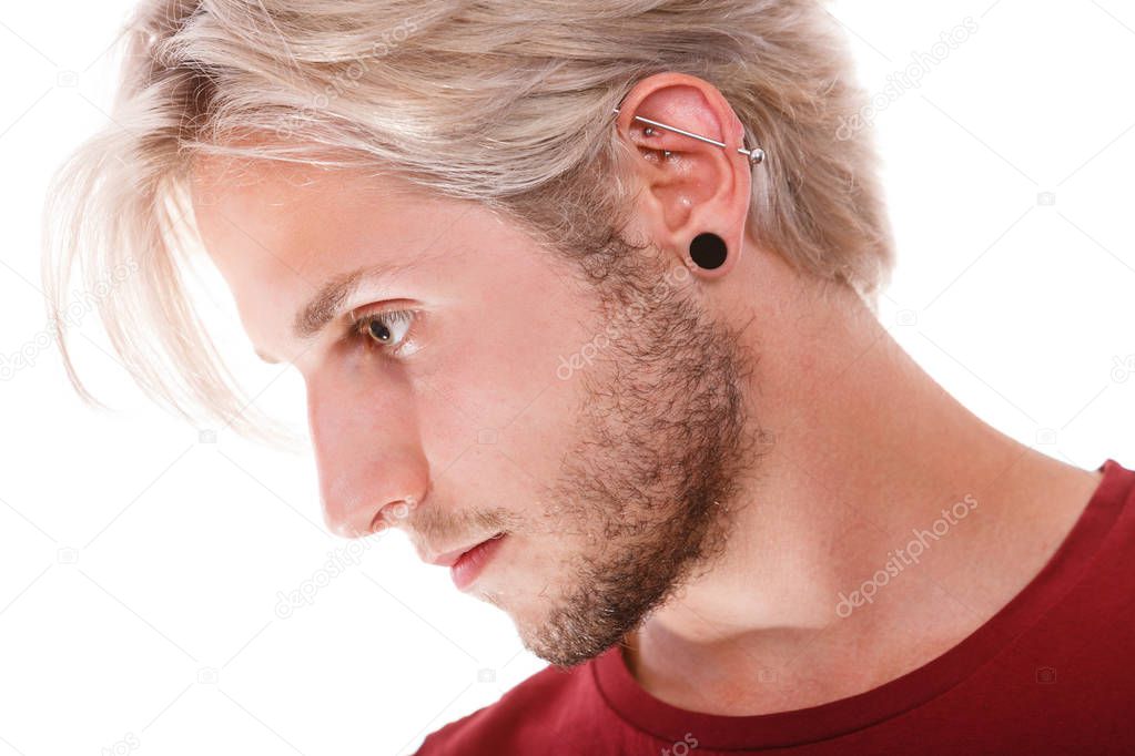 Teen boy with piercing and fashionable hairstyle