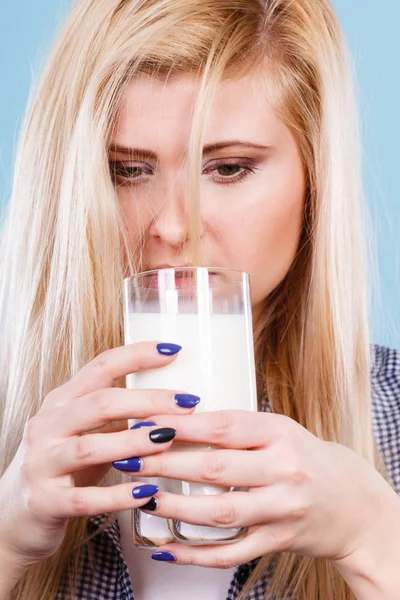 Woman drinking milk from glass