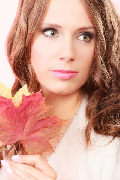 Lovely autumnal girl with maple leaves in hand — Stock Photo, Image