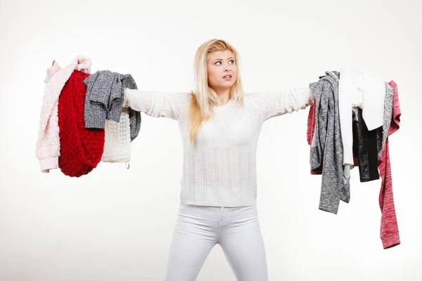 Woman holding many clothing — Stock Photo, Image