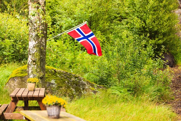 norwegian flag and green picnic site