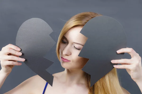 Young sad woman covered by broken heart. — Stock Photo, Image