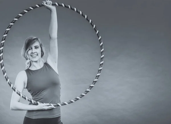 Fit woman with hula hoop doing exercise — Stock Photo, Image