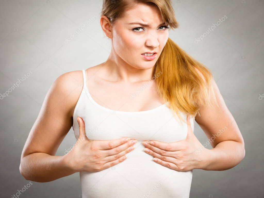 Woman suffering from breast pain