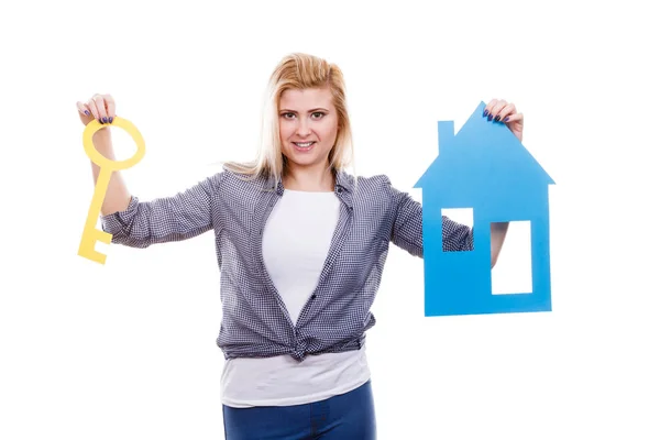 Happy woman holding blue paper house — Stock Photo, Image