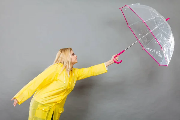 Woman holding transparent umbrella — Stock Photo, Image