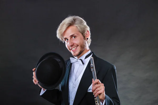 Elegantly dressed musician holding flute — Stock Photo, Image