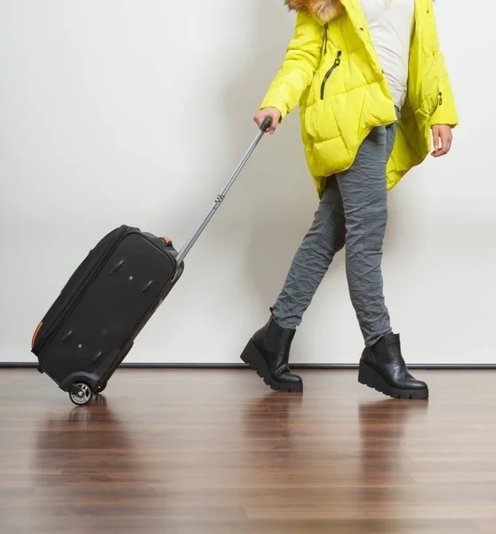 Woman in warm jacket with suitcase. — Stock Photo, Image