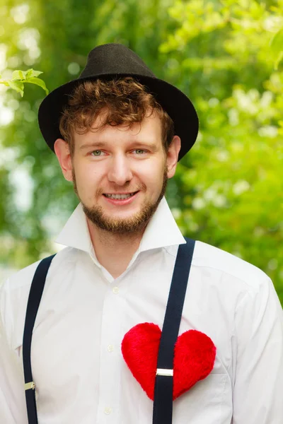 Young man retro style with red heart on chest — Stock Photo, Image