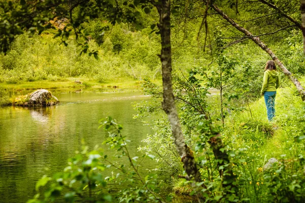 Tourist woman on river bank, Norway. — Stock Photo, Image