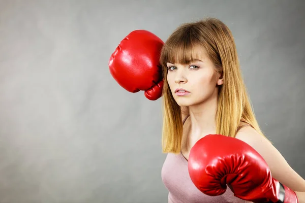 Woman wearing boxing gloves — Stock Photo, Image