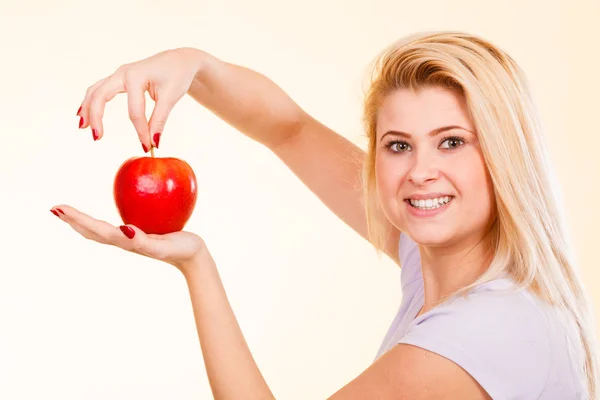 Happy woman holding delicious red apple — Stock Photo, Image