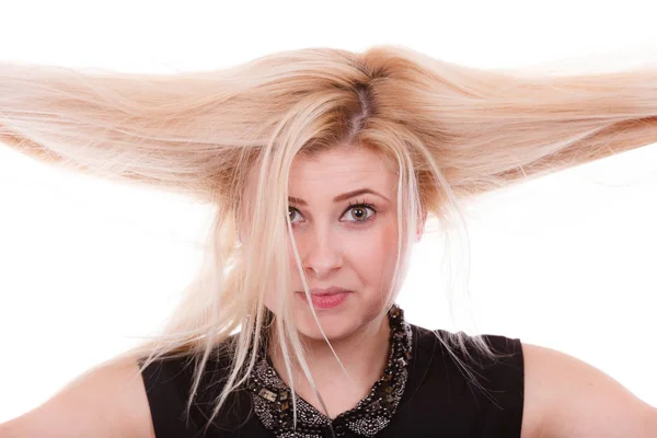 Mujer rubia sosteniendo su cabello seco —  Fotos de Stock